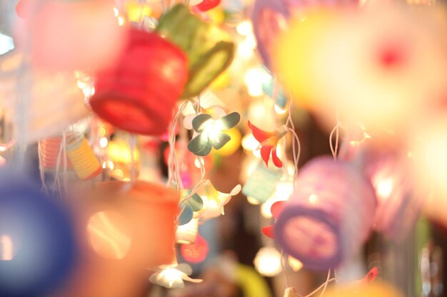 Photo close-up of illuminated decorations hanging