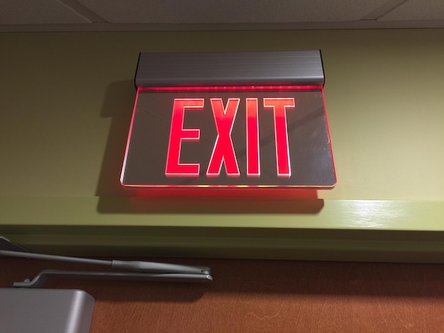 Close-up of illuminated exit sign