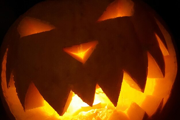 Close-up of illuminated halloween pumpkin at night