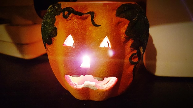 Photo close-up of illuminated halloween pumpkin