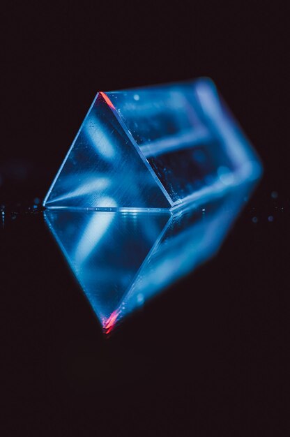 Close-up of illuminated lighting equipment against black background