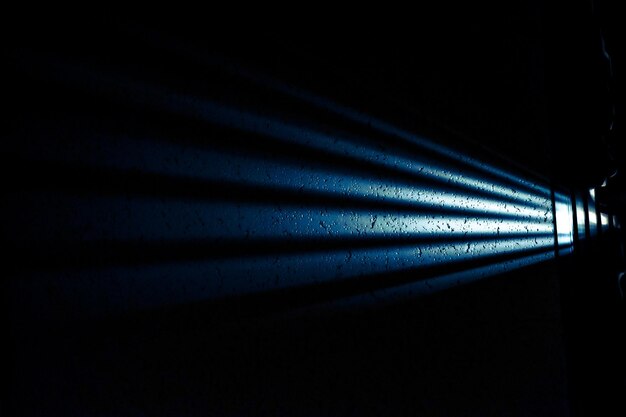 Photo close-up of illuminated lighting equipment in dark room