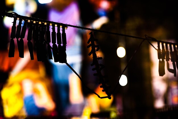 Close-up of illuminated lights hanging at night