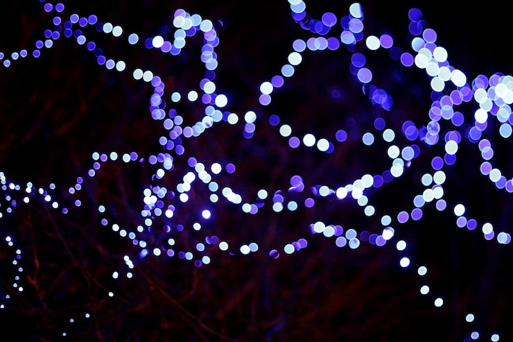 Photo close-up of illuminated lights at night