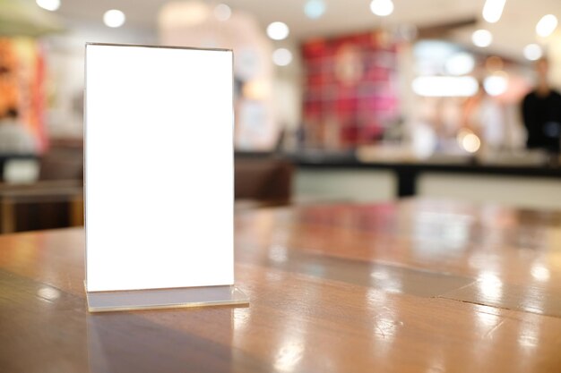 Close-up of illuminated placard on table