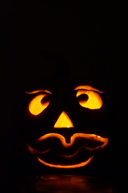 Photo close-up of illuminated pumpkin during halloween