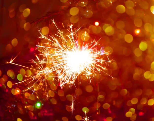 Close-up of illuminated sparkler at night