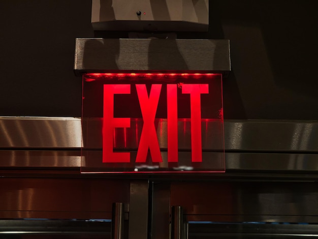 close-up of illuminated text on red wall