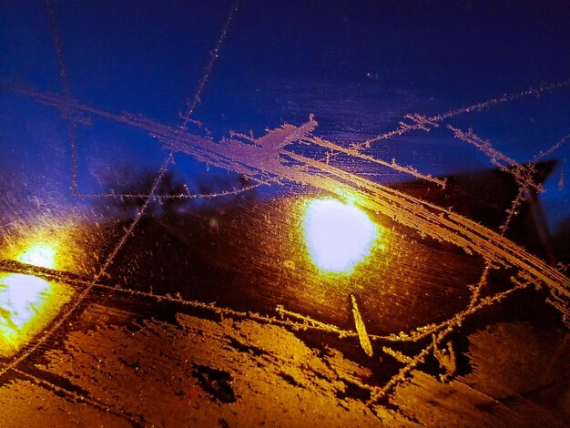 Close-up of illuminated vapor trail in winter