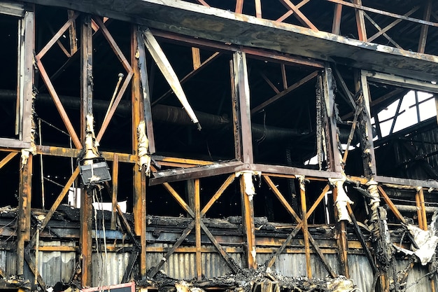 Close up image of burned down wooden house.