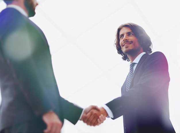 Close up image of business handshake at meeting