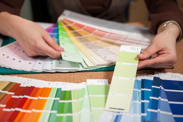 Close up image of color cards on architect desk. Architecture and construction. Color pallete
