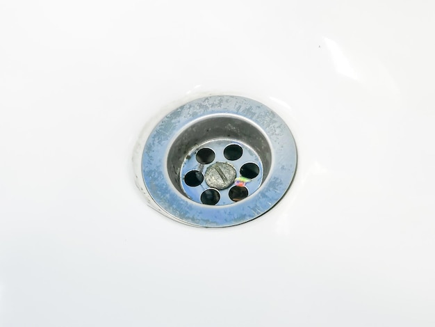 Close up image of dirty sink strainer.