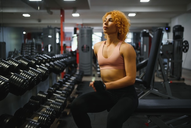 Close up image of fit woman in gym