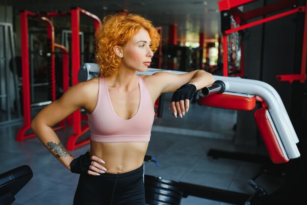 Close up image of fit woman in gym