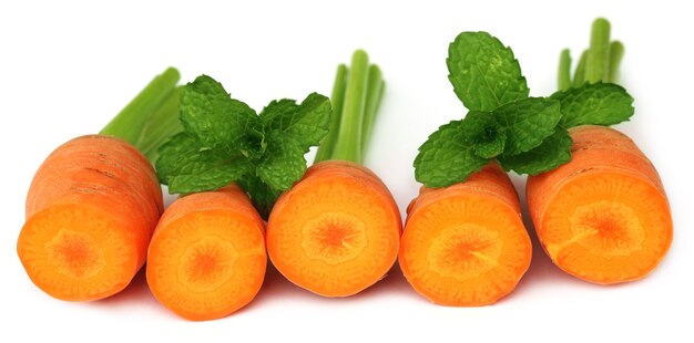 Close up image of fresh carrots with mint leaves