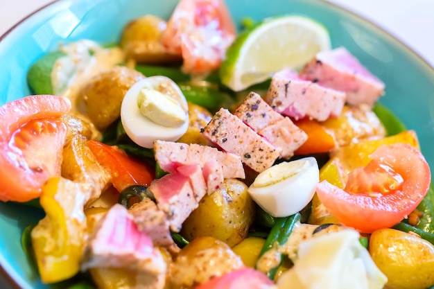 Close up image of fresh and tasty Nicoise salad with tuna fish.