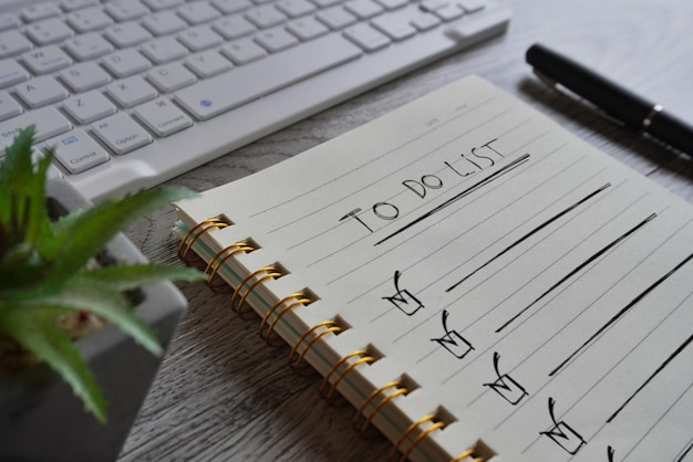 Photo close up image of notebook with text to do list on table