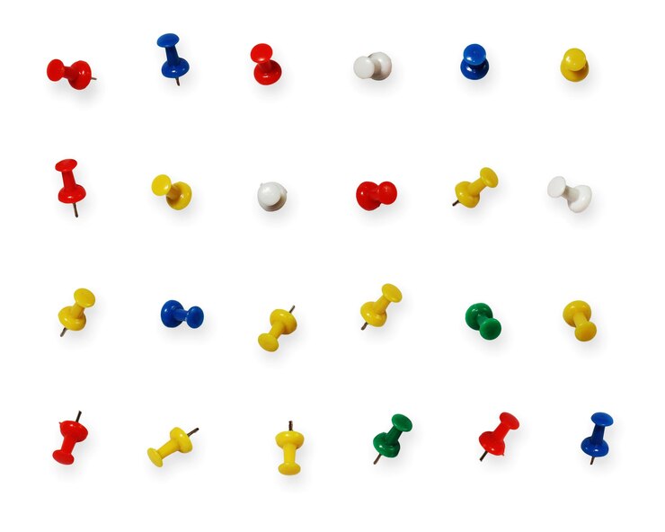 फोटो close up image of push pins in different positions isolated on white
