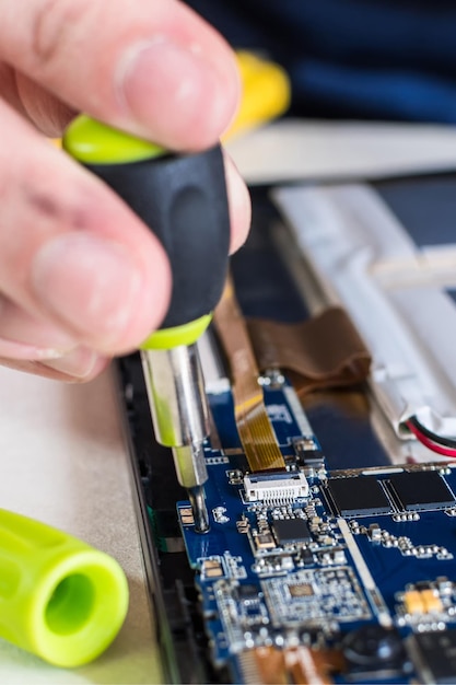 Close up image of smart phone and tablet repair in technology lab