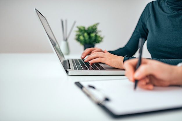 Close-up image of two business women working. Copy space.