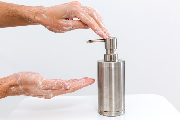 Close up image of washing hand against white background