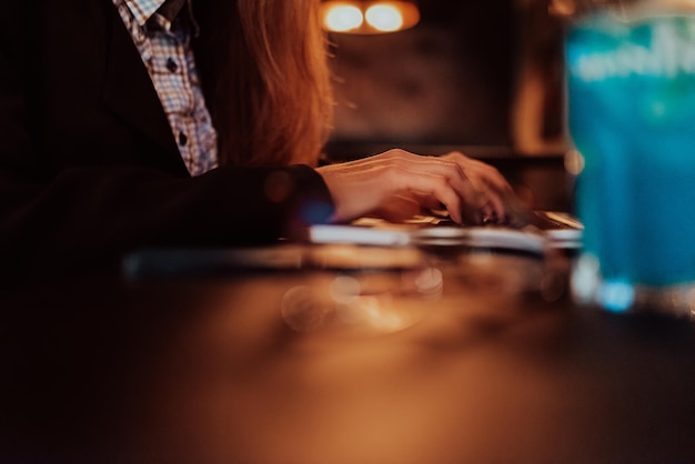 Close up image of woman hands typing on laptop computer keyboard and surfing the internet on office table, online, working, business and technology, internet network communication concept. High qualit