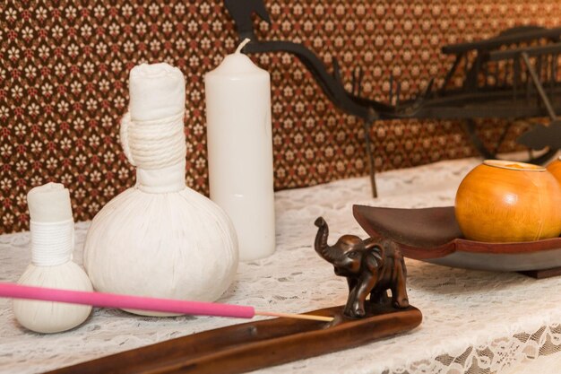 Photo close-up of incense by decoration on table