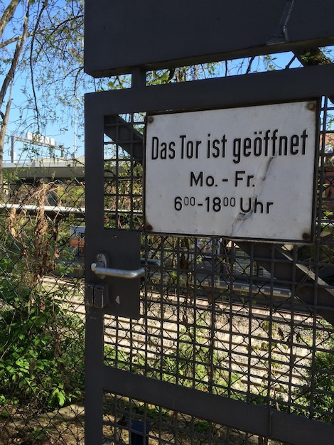 Photo close-up of information sign on gate