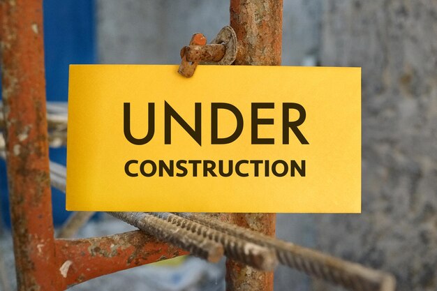 Photo close-up of information sign rusty pipe