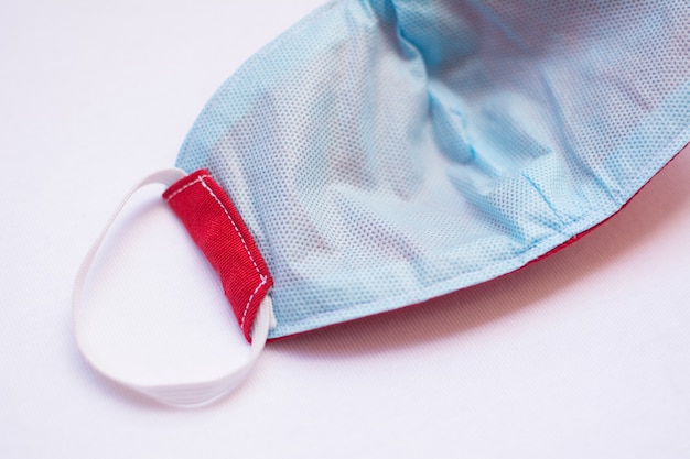 Close-up of the inner part of a protective mask, with TNT material for protection against the pandemic, isolated.