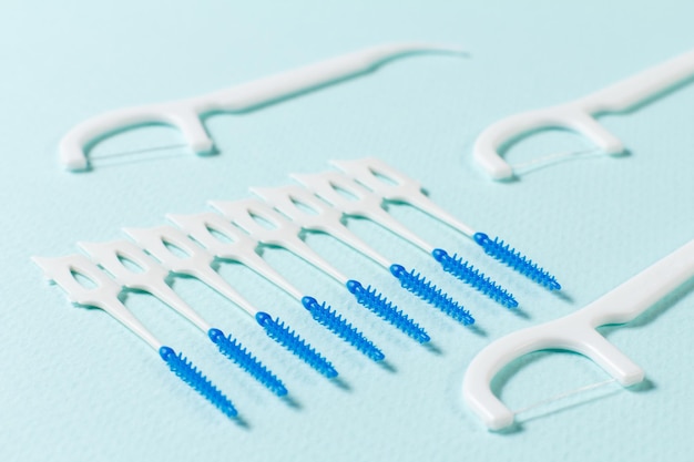 Close-up interdental brushes on the blue background