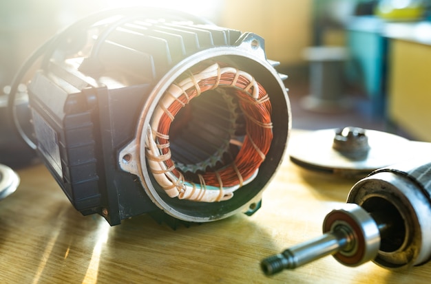 Close-up of iron industrial motor lies on a table