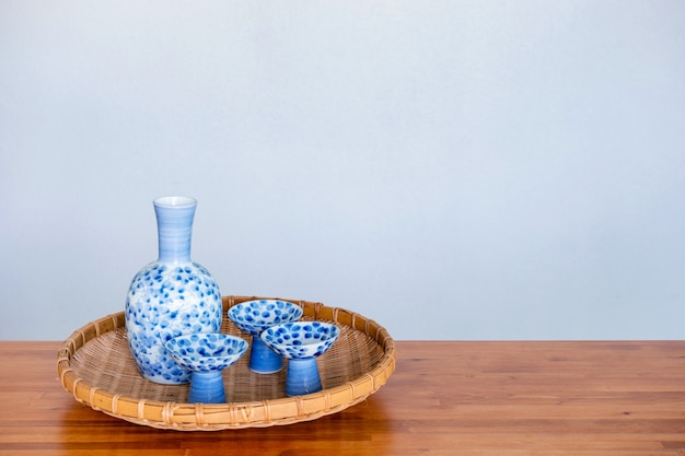 Close up of Japanese Sake drinking set on a white background.