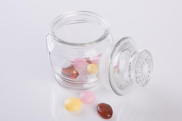 Close-up of jar over white background