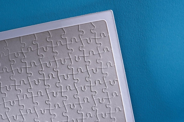 Close up jigsaw puzzle on blue background