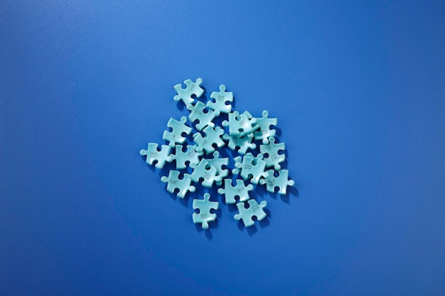 Close-up of jigsaw puzzle on blue table