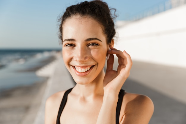 Close up joyful young sportswoman