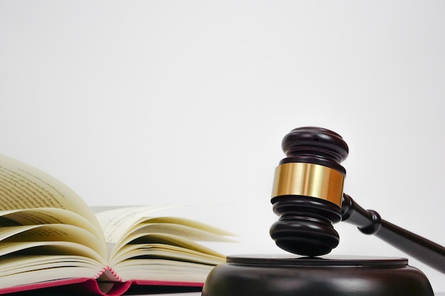 Close up of judge gavel lawyer law justice with law book in background