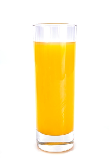 Photo close-up of juice in drinking glass against white background