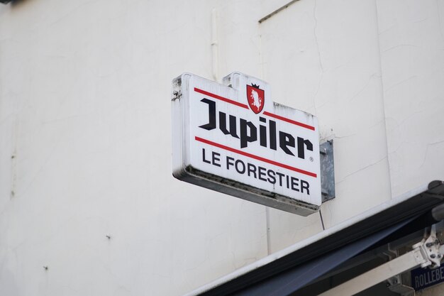 Photo close-up of jupiter le forestier sign