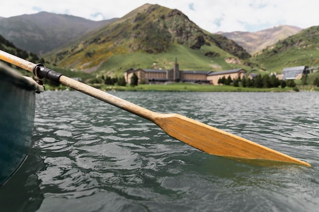 Close up on kayak canoe paddle in the river