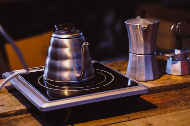 Close-up of kettle on induction stove