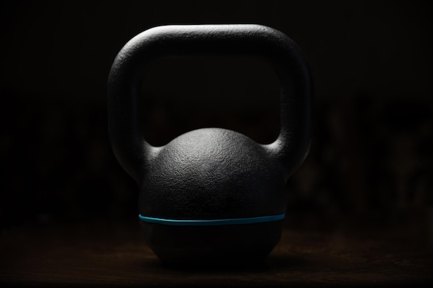 Photo close-up of kettlebell against black background