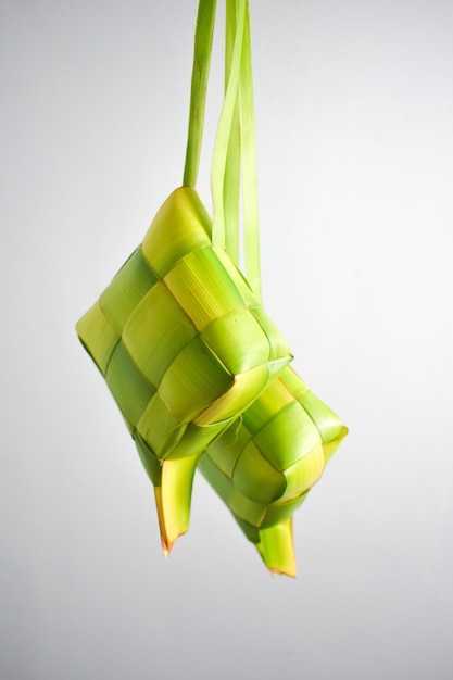 Close up Ketupat and copy space with isolated white background Traditional culture in indonesia wel