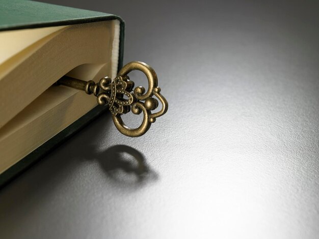 Photo close-up of key on book over table