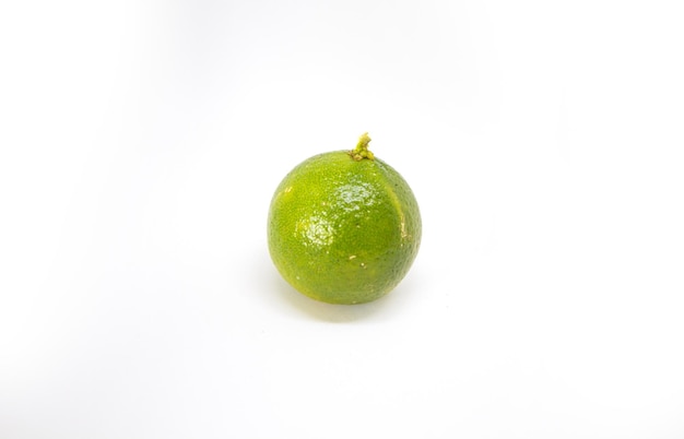 Photo close-up of key lime against white background