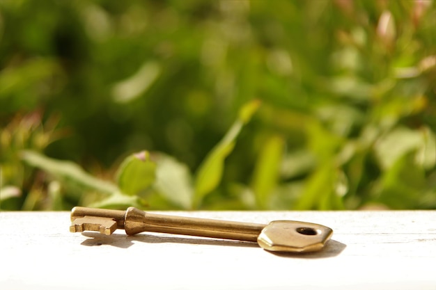 Close-up of key on table outdoors