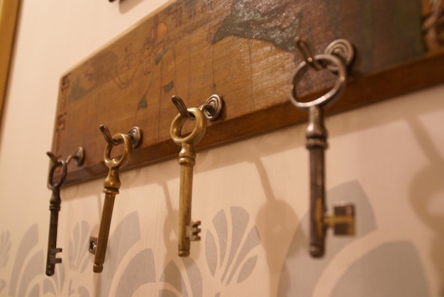 Close-up of keys hanging on hooks