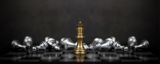 Close up king chess stand with falling chess on the back concept of team player or business team and leadership strategy and human resources organization management